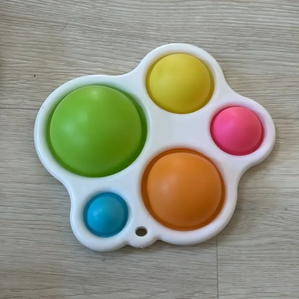 Hard plastic dimple pop perfect for babies sanitizable like new 4 total fodgets